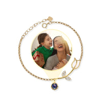 Thumbnail for Tulip Photo Bracelet by Brother & Sisters featuring a tulip charm and a hidden photo projection of loved ones.