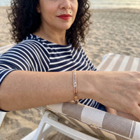 Thumbnail for Be Gorgeous, Be Yourself bracelet in rose gold worn during a relaxed moment | SKU: bgby-rg