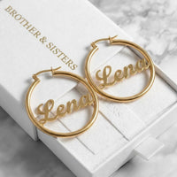 Thumbnail for Custom Name Hoop Earrings in Gold in the Brother & Sisters gift box | SKU: name-hoop-gold-30-mm