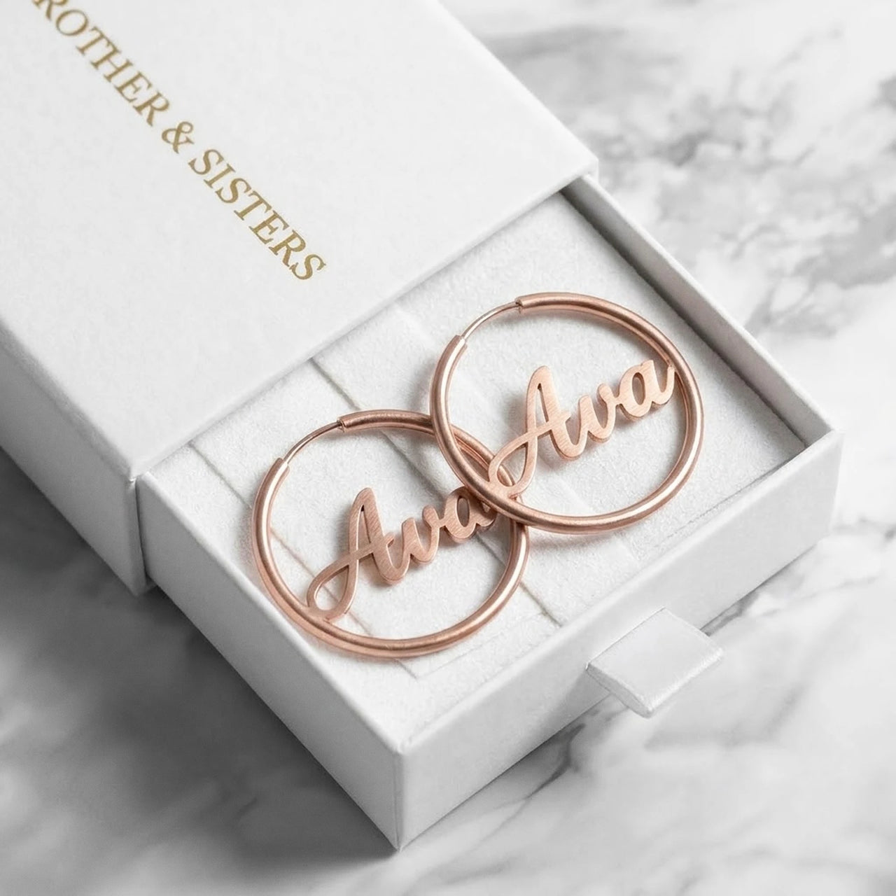 Custom Name Hoop Earrings in Rose Gold in the Brother & Sisters gift box | SKU: name-hoop-rose-gold-30-mm
