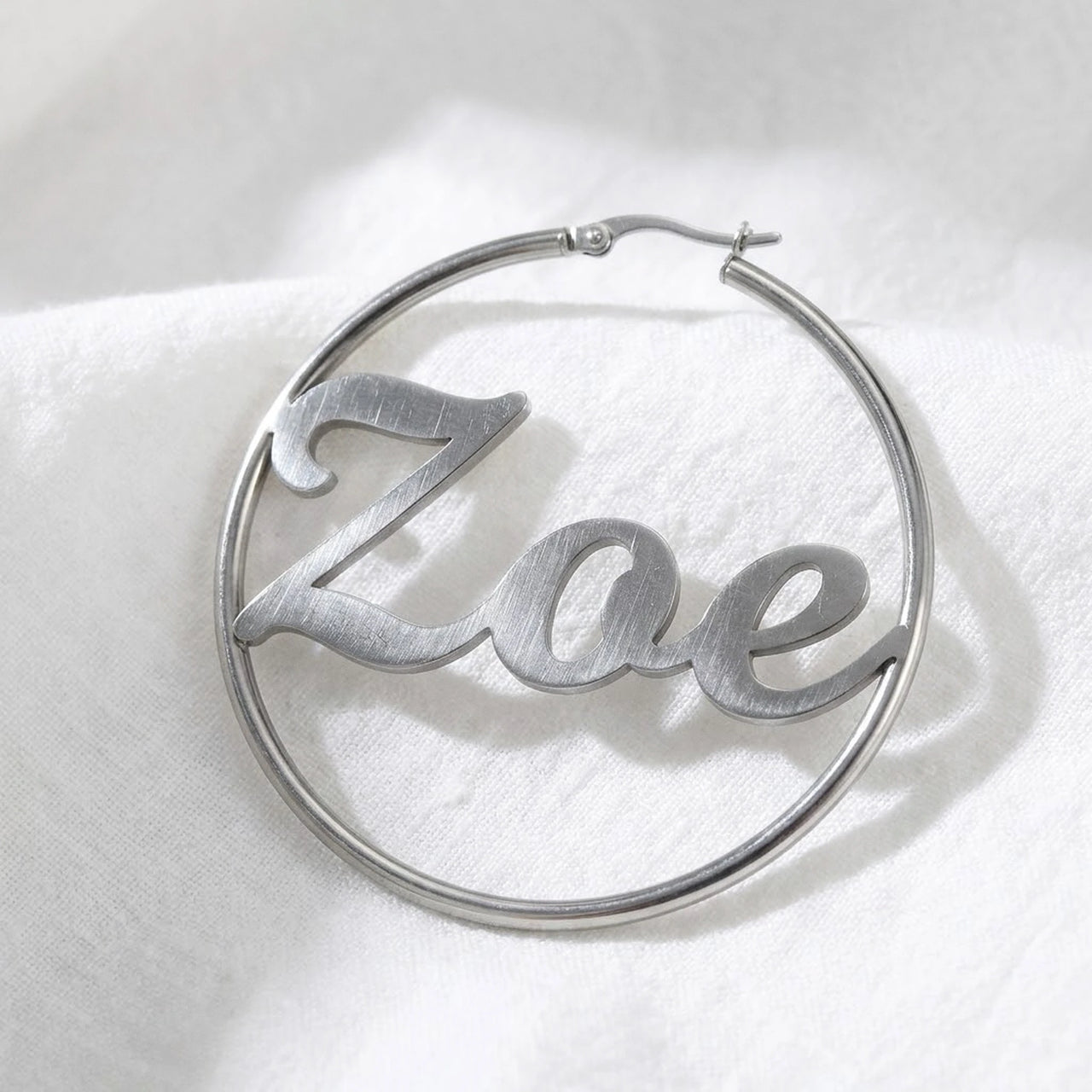 Custom Name Hoop Earrings in Silver, macro detail of the metal and the finish | SKU: name-hoop-silver-30-mm