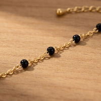 Thumbnail for Gold & Onyx Bead Anklet features glossy black enamel beads on a gold chain by Brother & Sisters.