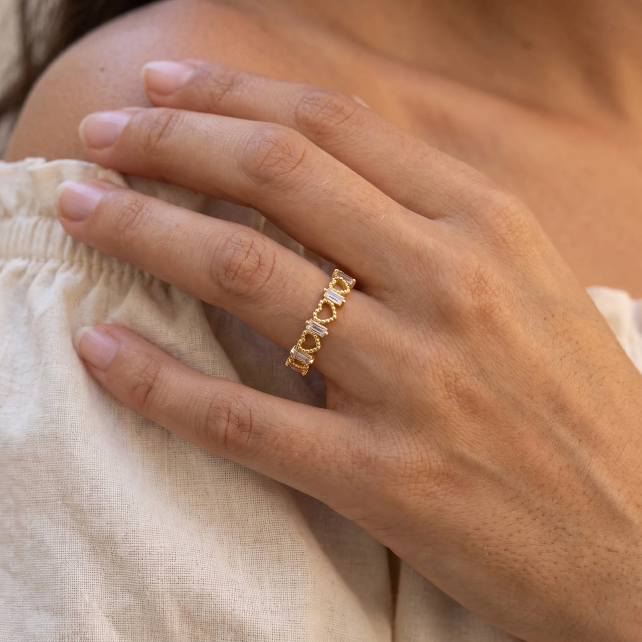 Close-up of the Hearts ring in gold worn | SKU: lescoeurs