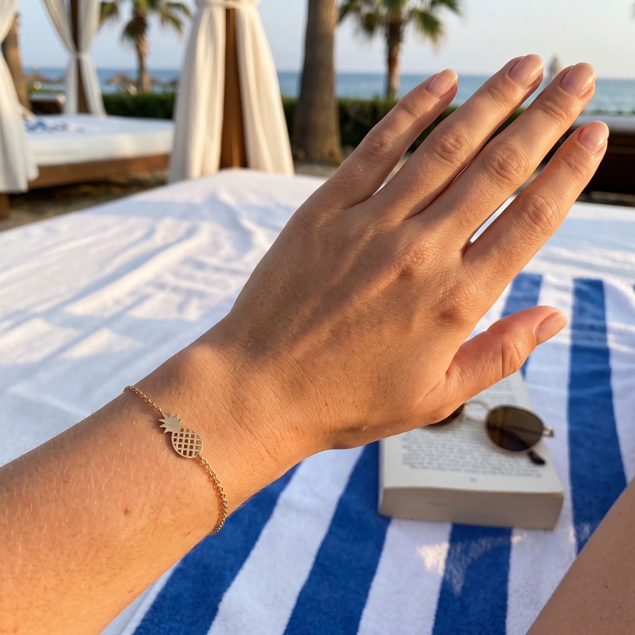 Gold charm bracelet worn, showing its real size | SKU: 9178613-gold