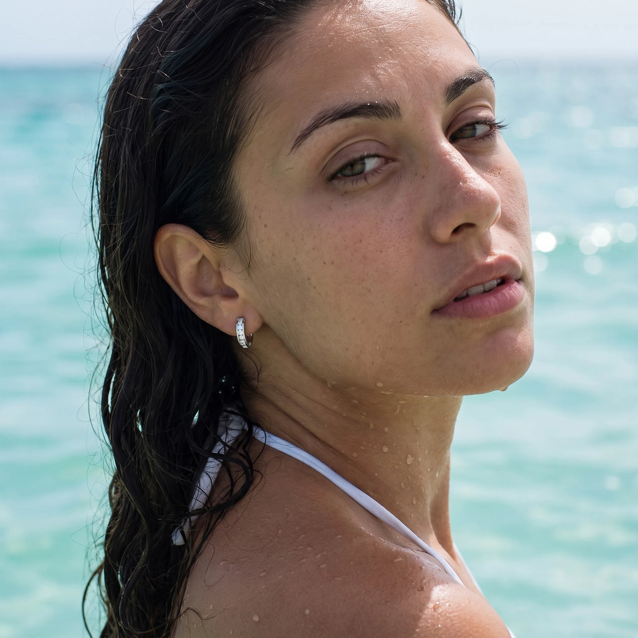 Silver huggie hoop earrings worn in the sea, waterproof stainless steel with water drops | SKU: 22023999-rhodium