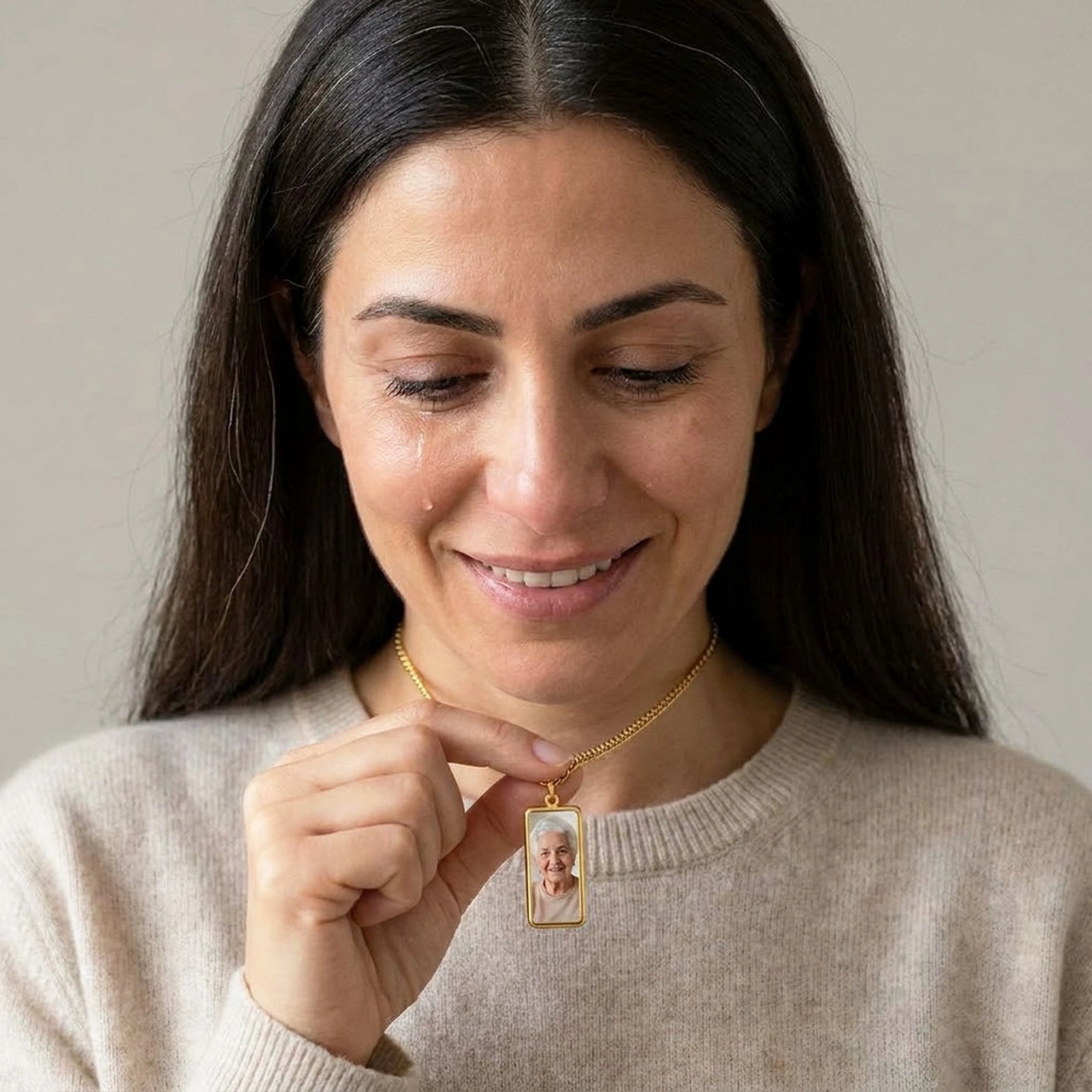 Woman moved as she looks at her late grandmother's photo in the gold bar necklace | SKU: TPH-BARN-GOLD