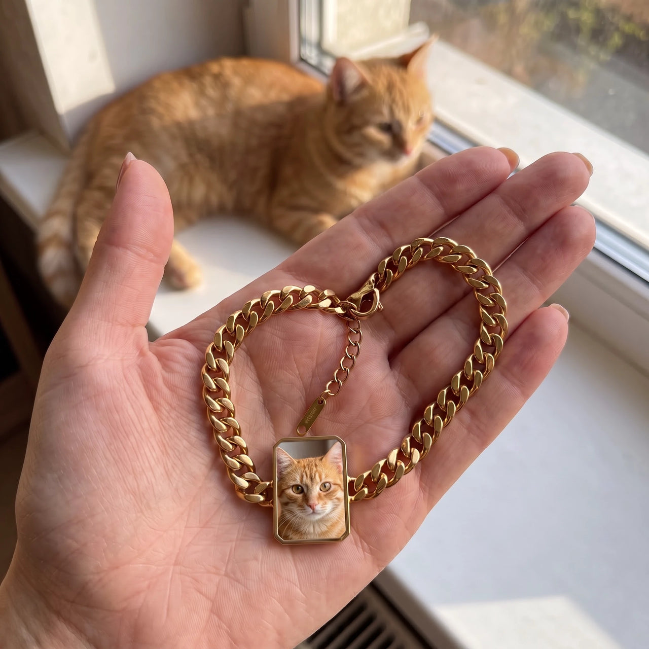 Customer photo: the gold cushion-cut bracelet with her ginger cat's photo, her cat in the background | SKU: TPH-CUSB-GOLD