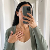 Thumbnail for Mirror selfie of a woman in a green cardigan wearing the gold secret drop photo necklace | SKU: TPH-DRPN-GOLD