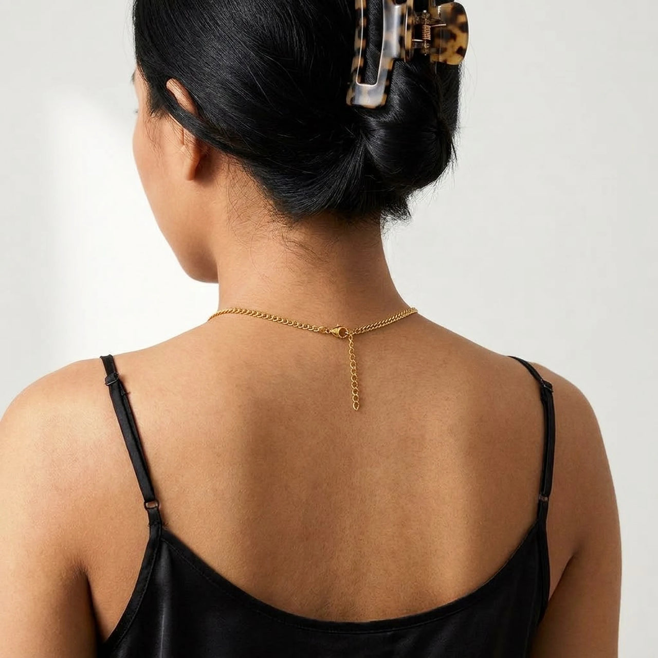 Back of the neck showing the lobster clasp and extension chain of the gold photo necklace | SKU: TPH-OVLN-GOLD