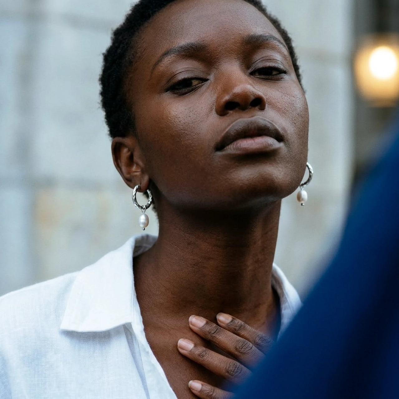 Twisted Pearl Drop Hoops in Silver, worn, close-up | SKU: 41004-silver